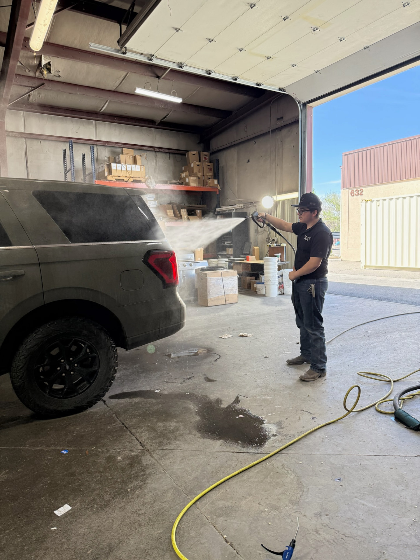 Close rinse pass along the Expedition tailgate and wheels
