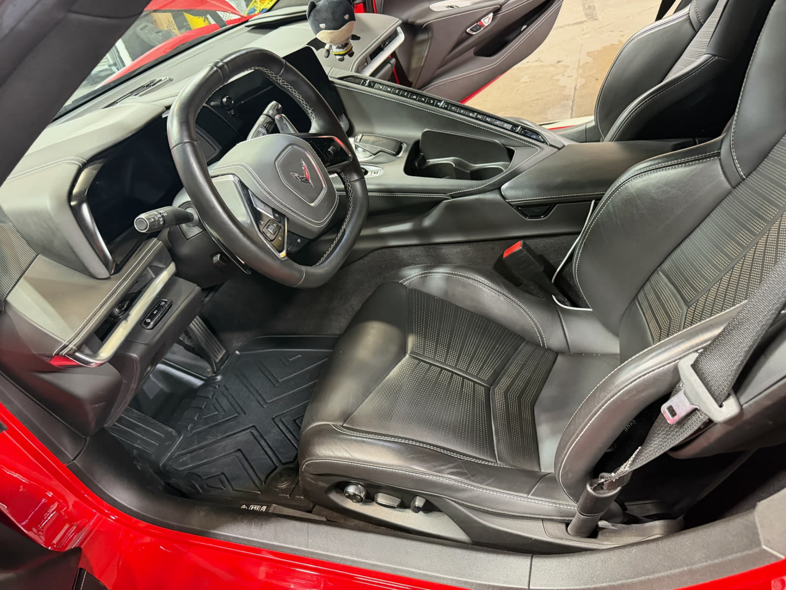 Clean black leather interior of a Corvette after an interior detail