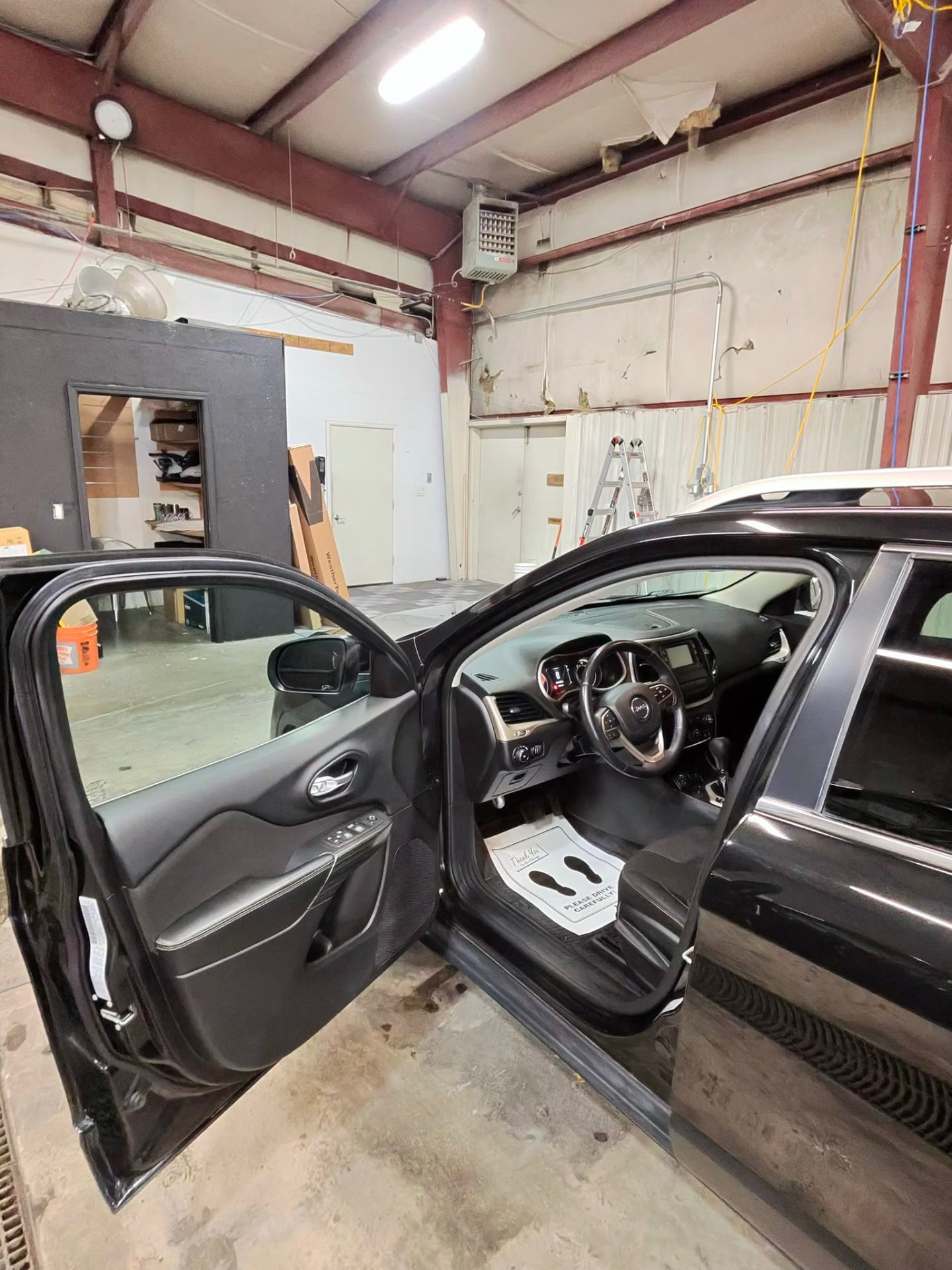 Driver side interior of the Jeep Cherokee cleaned and protected